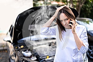 Woman Talking To Reliable Car Mechanic