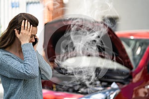 Woman Talking To Reliable Car Mechanic. Breakdown