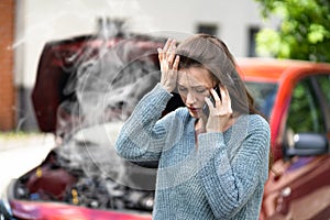 Woman Talking To Reliable Car Mechanic. Breakdown