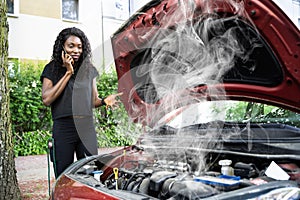 Woman Talking To Reliable Car Mechanic. Breakdown