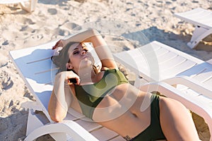 Woman tanning on the beach