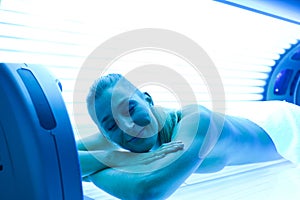 Woman on tanning bed