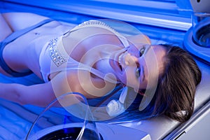 Woman on tanning bed