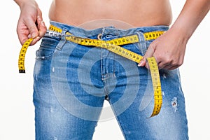 Woman with tape measure before the next diet