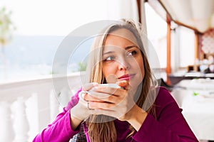 Woman tasting coffee