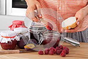 Woman tasting fresh jam