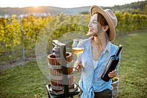 Woman tasting wine on the vineyard