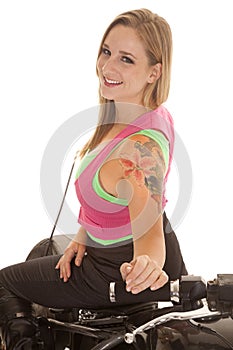 Woman tattoo motorcycle sit backwards smile