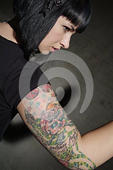 Woman with tattooed arm
