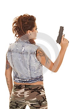 Woman tattoos gun back hold up