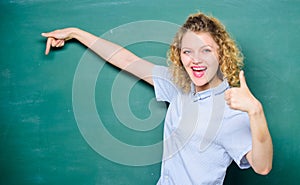 Woman teacher in front of chalkboard. Teacher explain hard topic. Good teacher master of simplification. Important