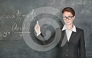 Woman teacher teaching maths