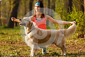 Woman teaching dog in park