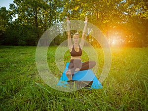 Woman teaching and practice yoga with laptop