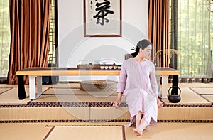 A woman with a teapot-China tea ceremony