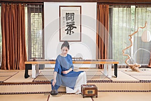 A woman with a teapot-China tea ceremony photo