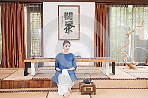 A woman with a teapot-China tea ceremony photo