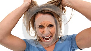 Woman tearing her hair