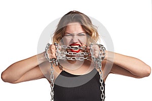 Woman tearing herself away from chains yelling