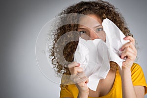 Woman tearing paper