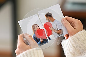 Woman tearing up photo of happy couple, closeup. Concept of divorce