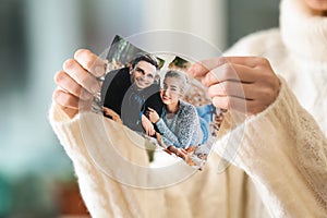 Woman tearing up photo of happy couple, closeup. Concept of divorce photo