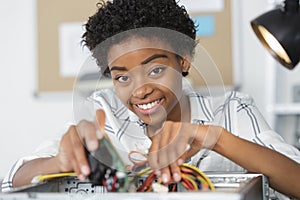 woman technician fixing computer