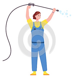 Woman technician hold water spray. Car wash worker