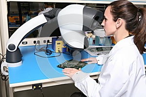 Woman Technician with Microscope