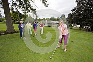 Woman Teeing Off