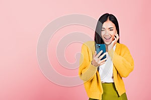 Woman teen smiling excited using smart mobile phone