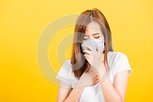 Woman teen standing cough in mask protection from virus epidemic or air pollution