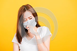 Woman teen standing cough in mask protection from virus epidemic or air pollution