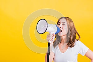 Woman teen standing making announcement message shouting screaming in megaphone