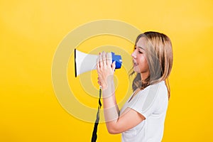 Woman teen standing making announcement message shouting screaming in megaphone