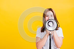 Woman teen standing making announcement message shouting screaming in megaphone