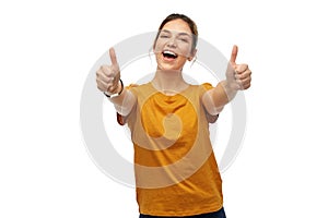 Woman or teenage girl in t-shirt showing thumbs up