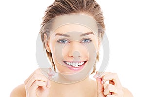 Woman with teeth floss