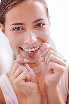 Woman, teeth and floss in portrait for dentistry with closeup, morning and cleaning mouth for dental hygiene. Female