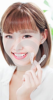 Woman with teeth invisible brace