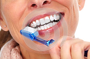 Woman teeth with toothbrush.