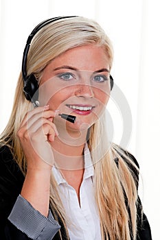 Woman with telephone headset in a call center