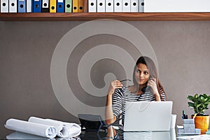 Woman, telephone and laptop at desk with call for discussion, conversation and talking to client. Receptionist, landline