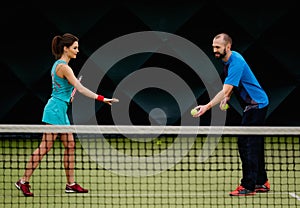 Woman tennis player with her coach