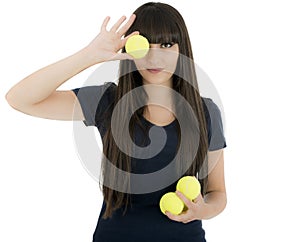 Woman tennis player holding a racket and balls, isolated on a white background.