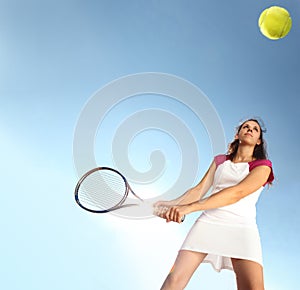 Woman tennis player with racket during a match game, isolated