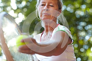 Woman, tennis racket and ball closeup for serve sport for workout, game play or match. Mature, female person and