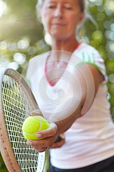 Woman, tennis racket and ready serve or ball on court for outdoor, competition or game match. Senior, female person and