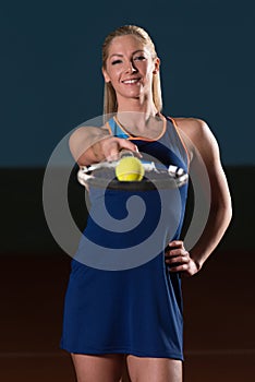 Woman With Tennis Racket And Tennis Balls photo