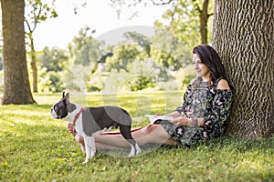 Woman with terrier dog outside at the park